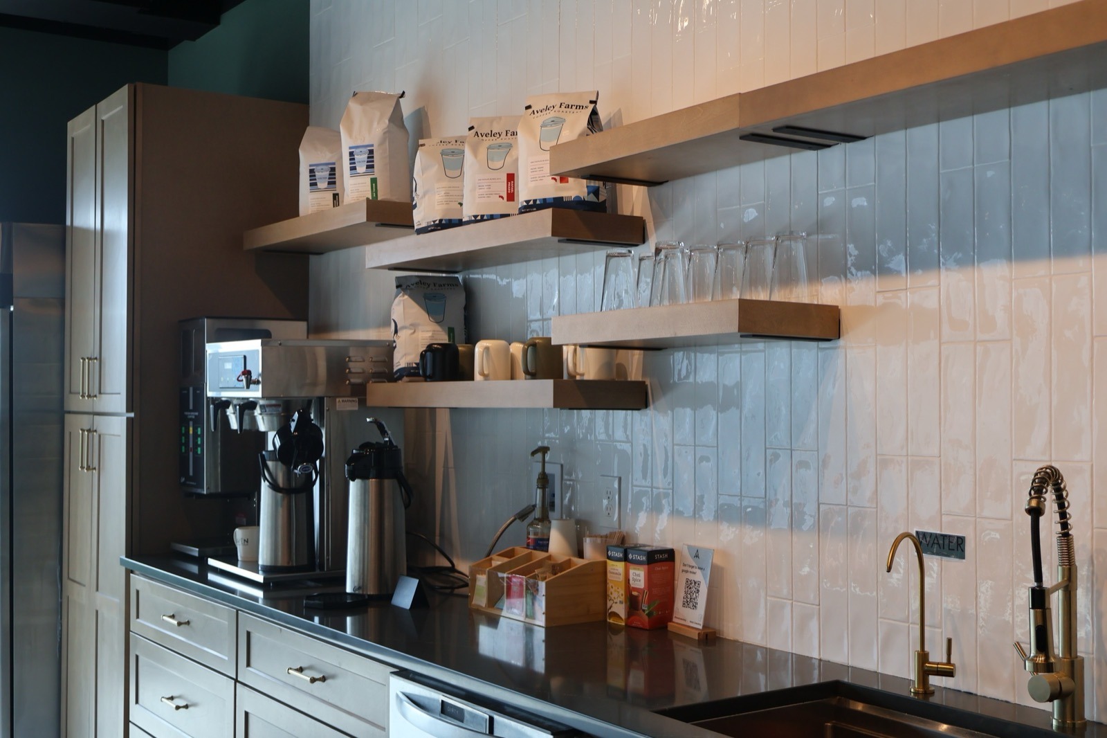 Complimentary iced water, tea, and coffee station in our building